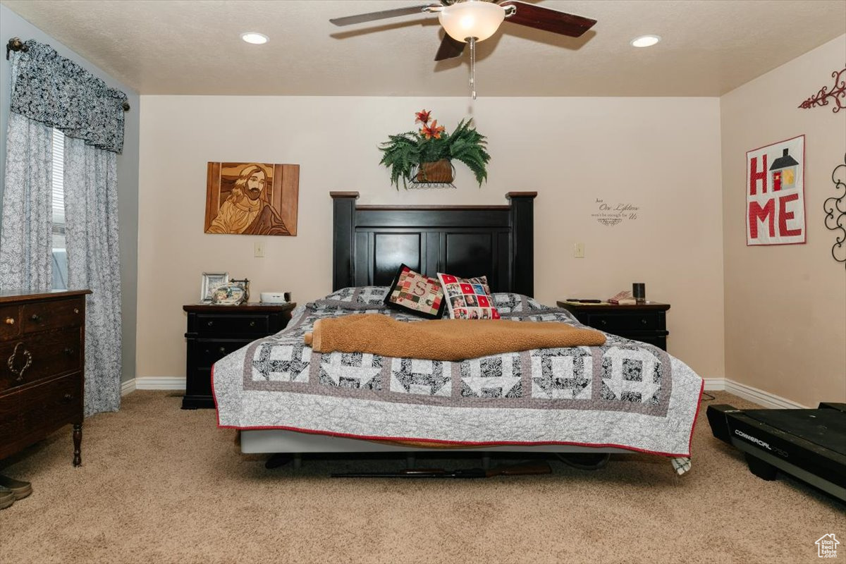 Bedroom with carpet floors and ceiling fan