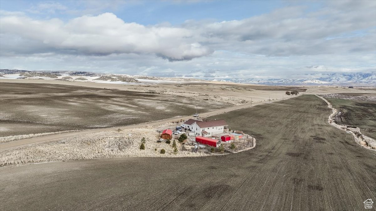 Birds eye view of property featuring a rural view