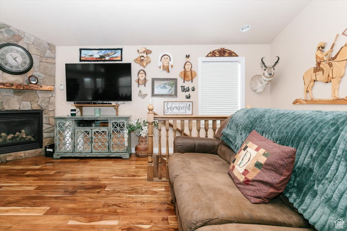 Living room featuring a fireplace and hardwood / wood-style floors