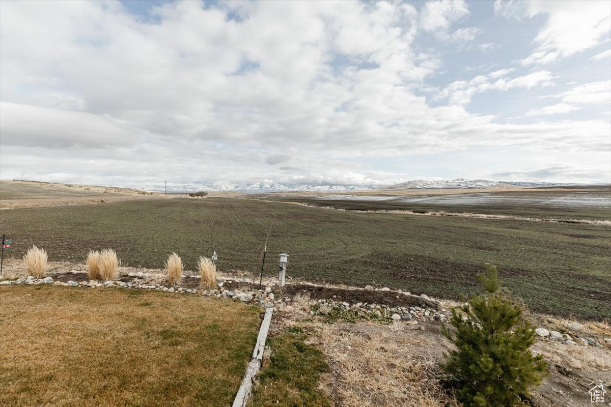 View of yard with a rural view