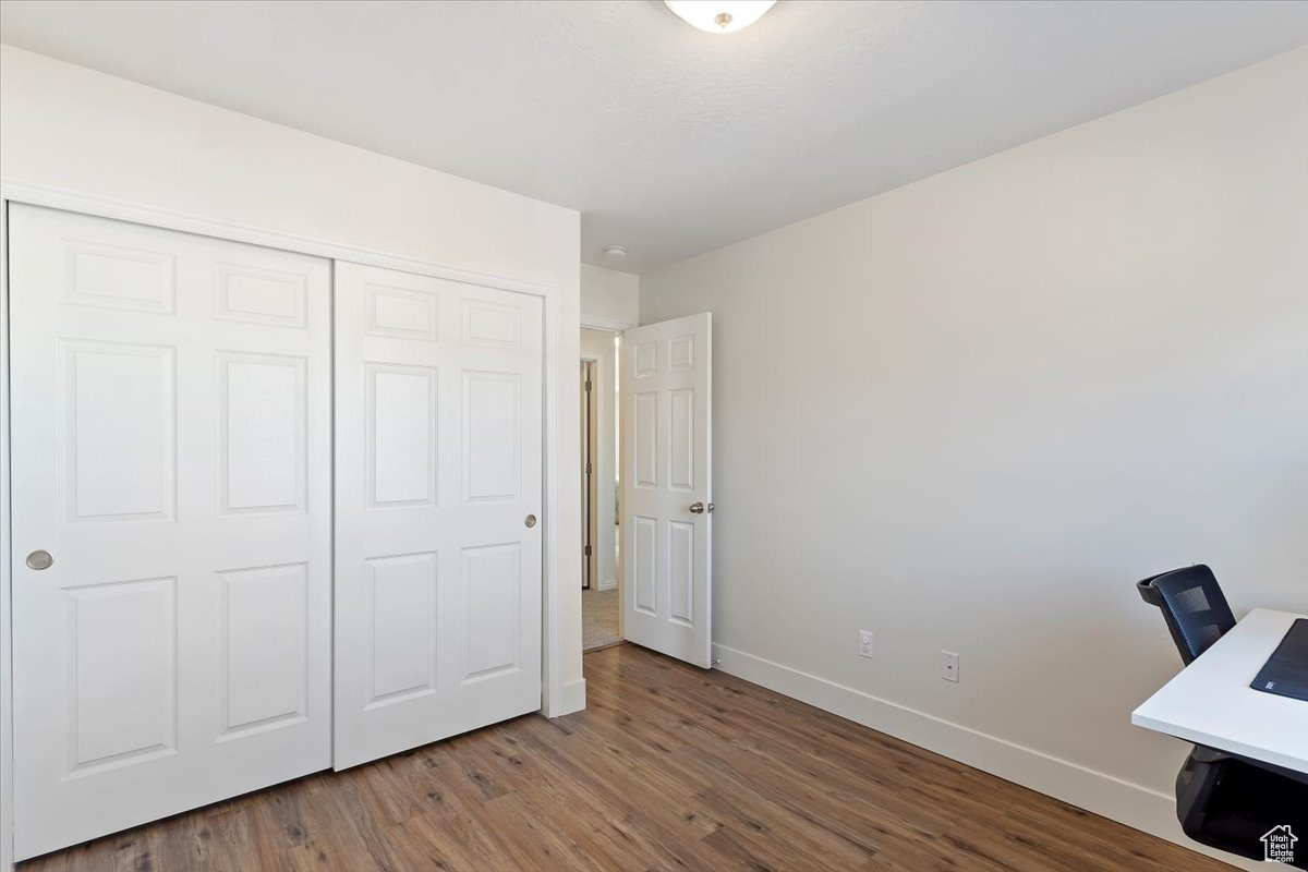 Unfurnished office featuring wood-type flooring