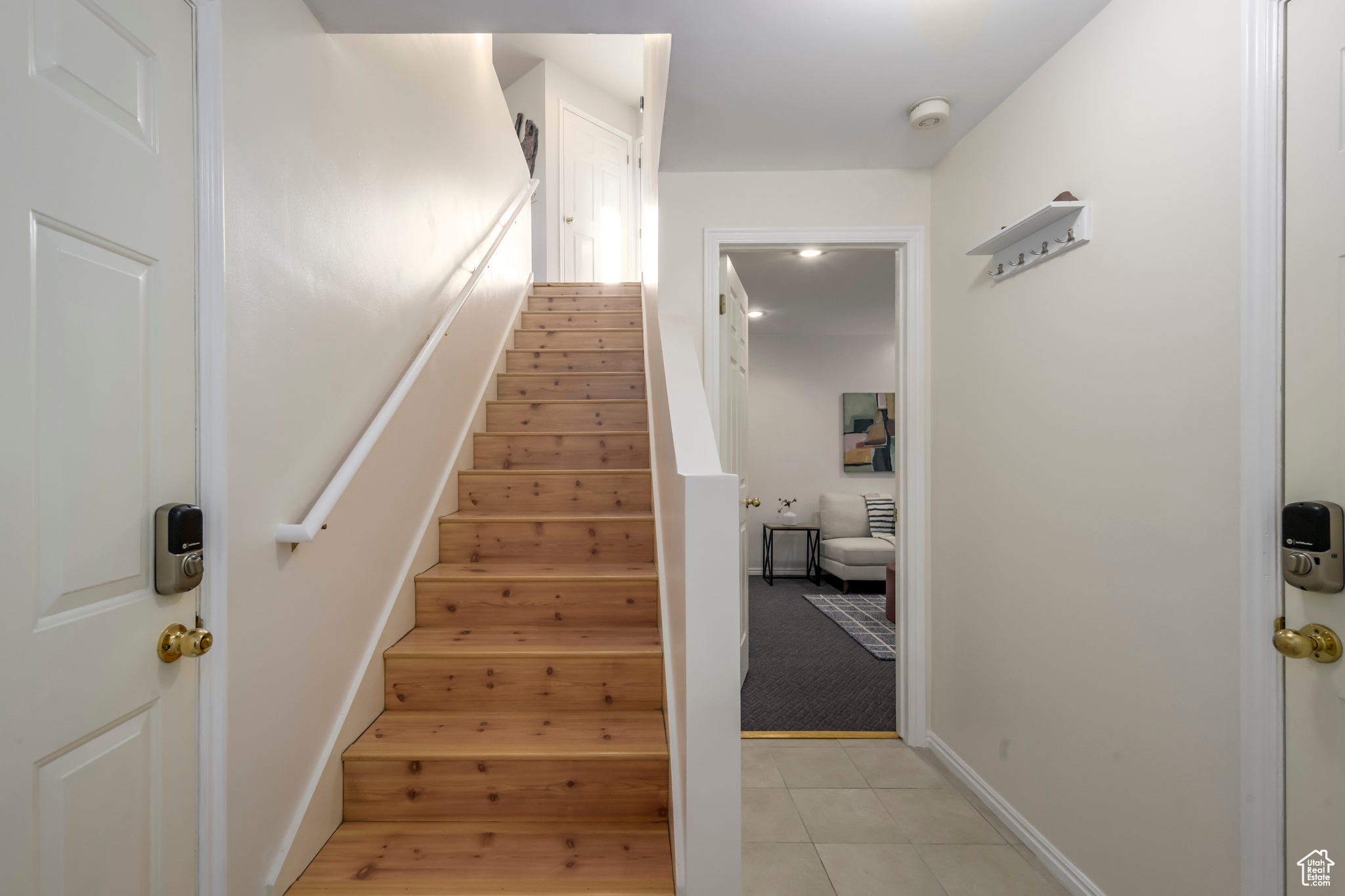 Staircase featuring carpet flooring