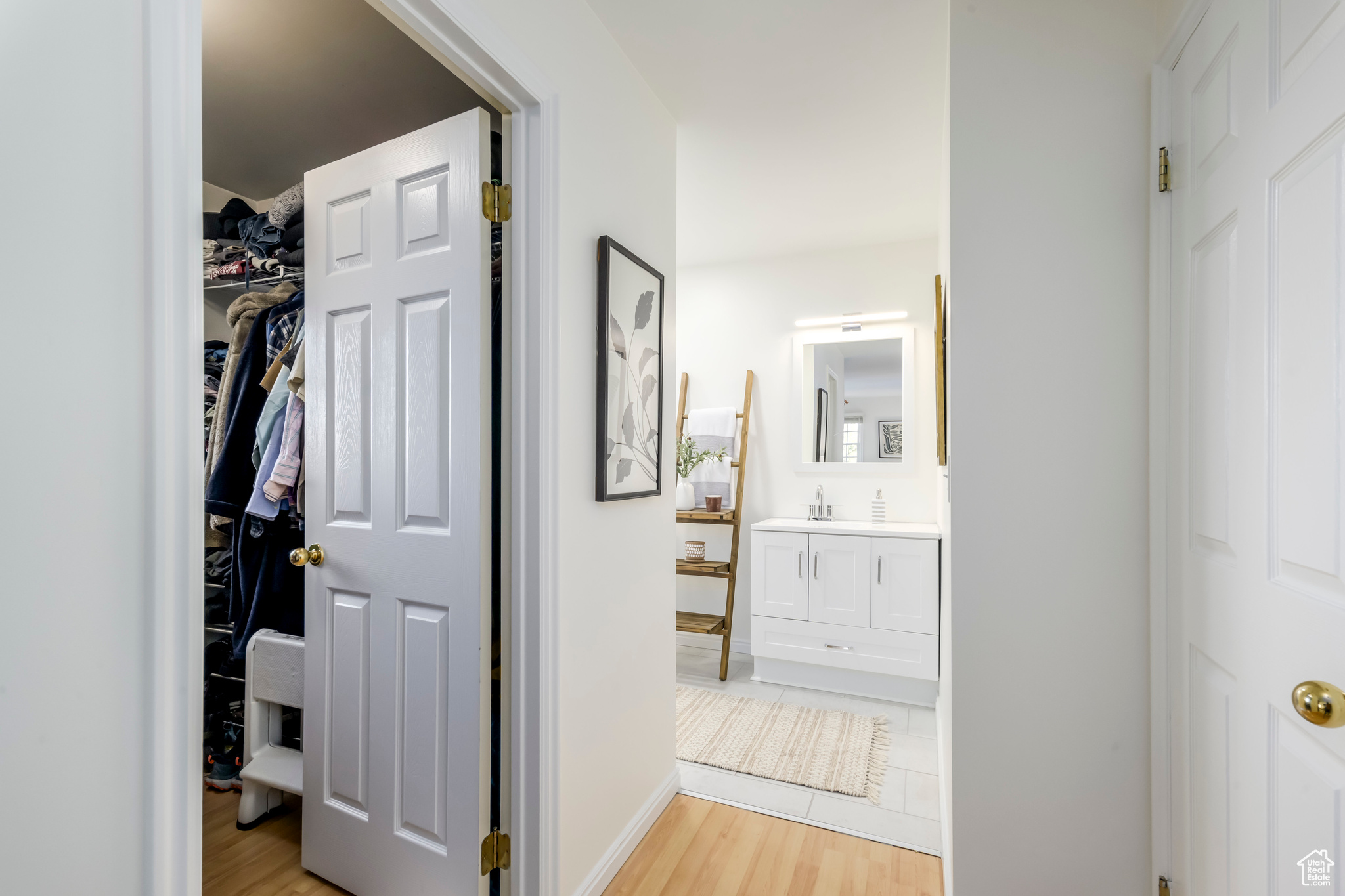 Primary walk in closet and updated bathroom