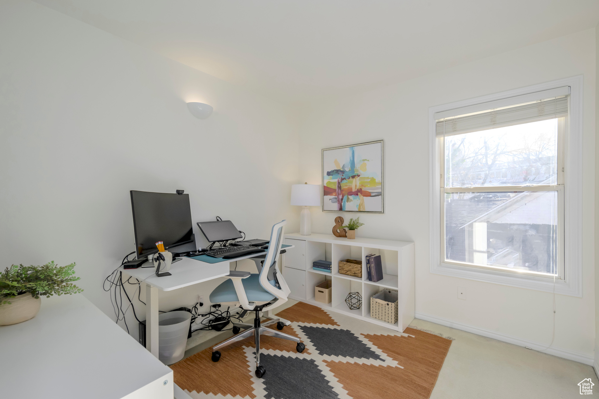 Upstairs office space featuring carpet