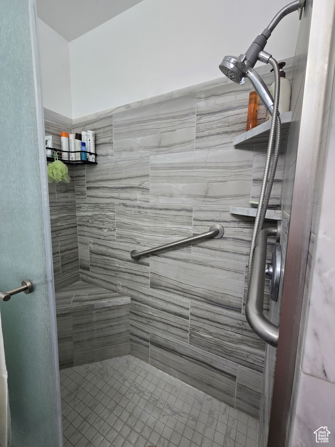 Bathroom featuring tiled shower