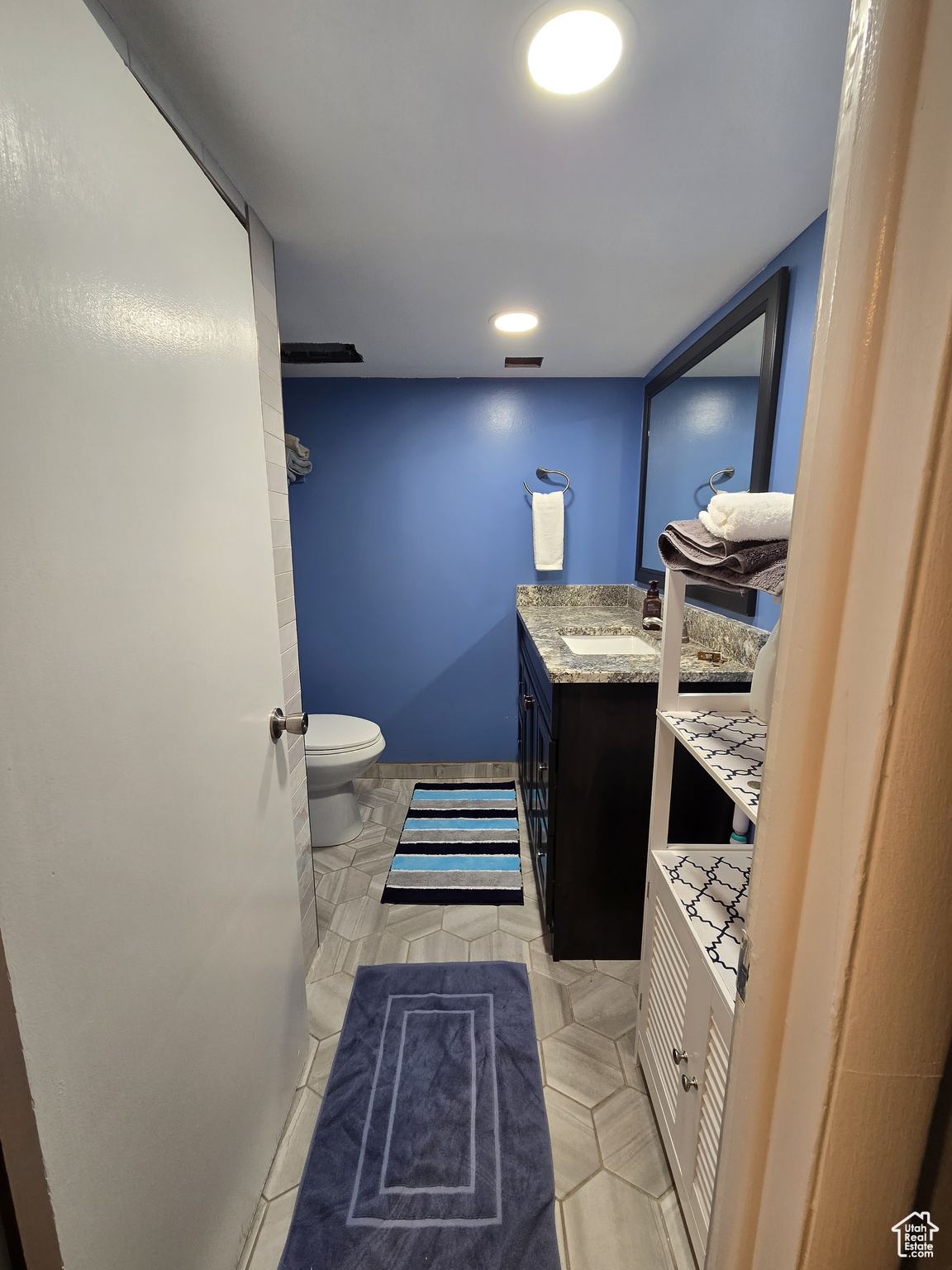 Bathroom with vanity and toilet