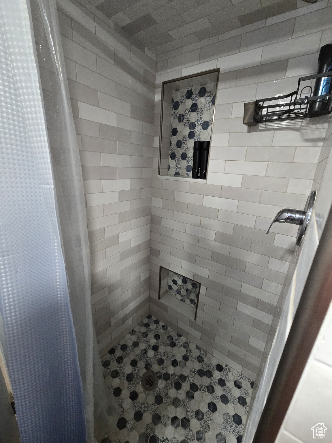 Bathroom featuring a shower with curtain