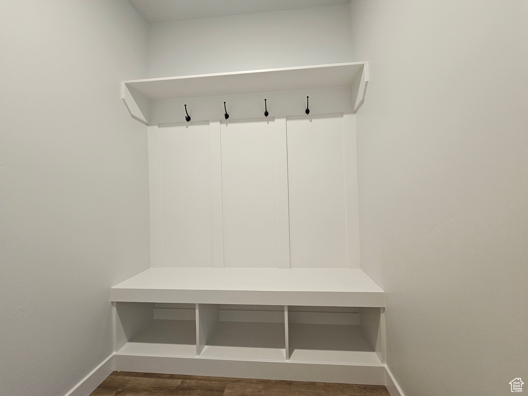 Mudroom featuring dark wood-type flooring