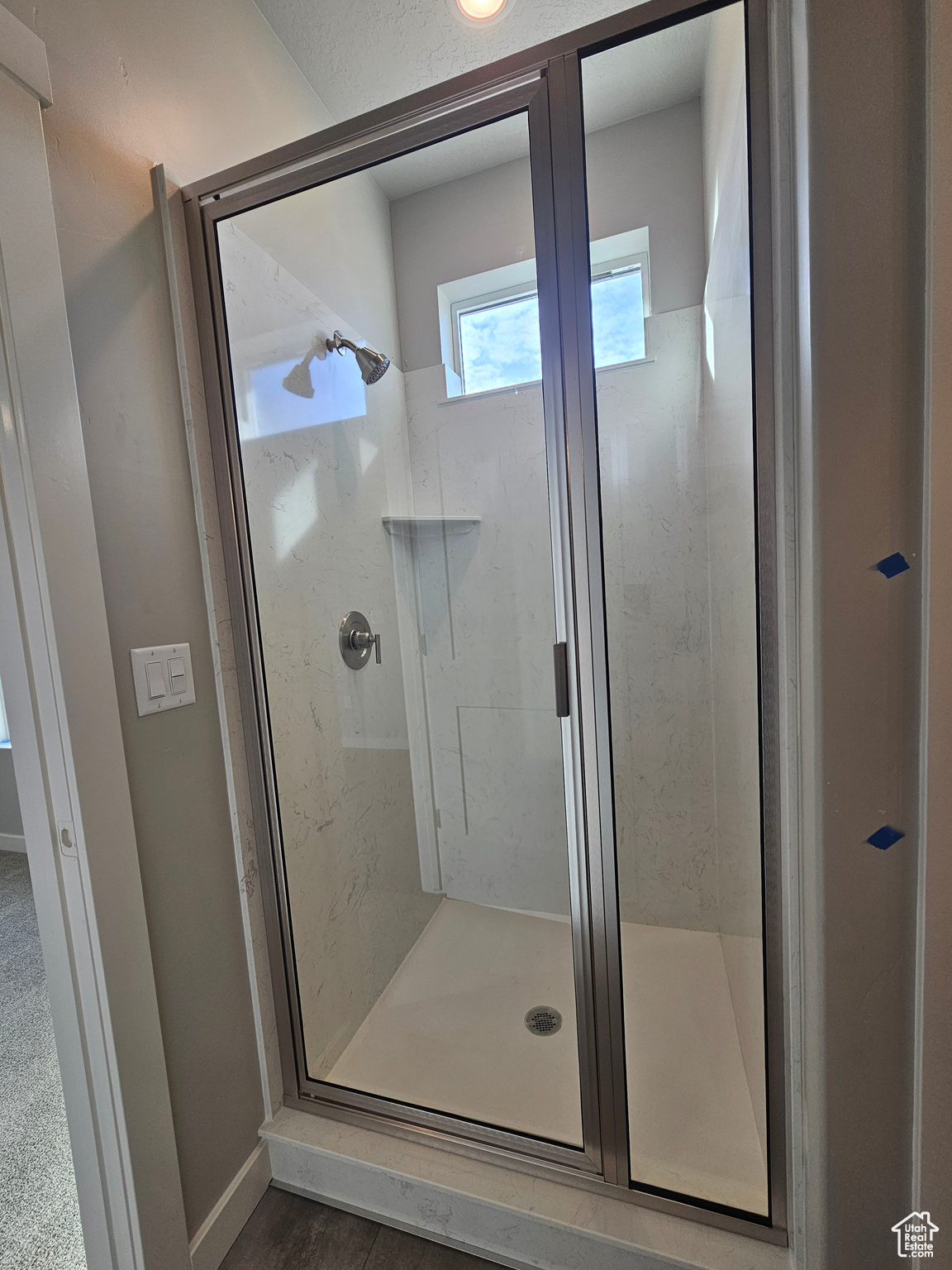 Bathroom featuring a shower with shower door