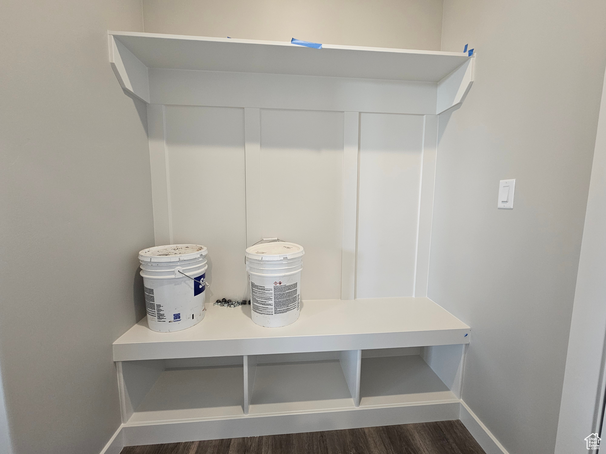 Mudroom featuring dark wood-type flooring