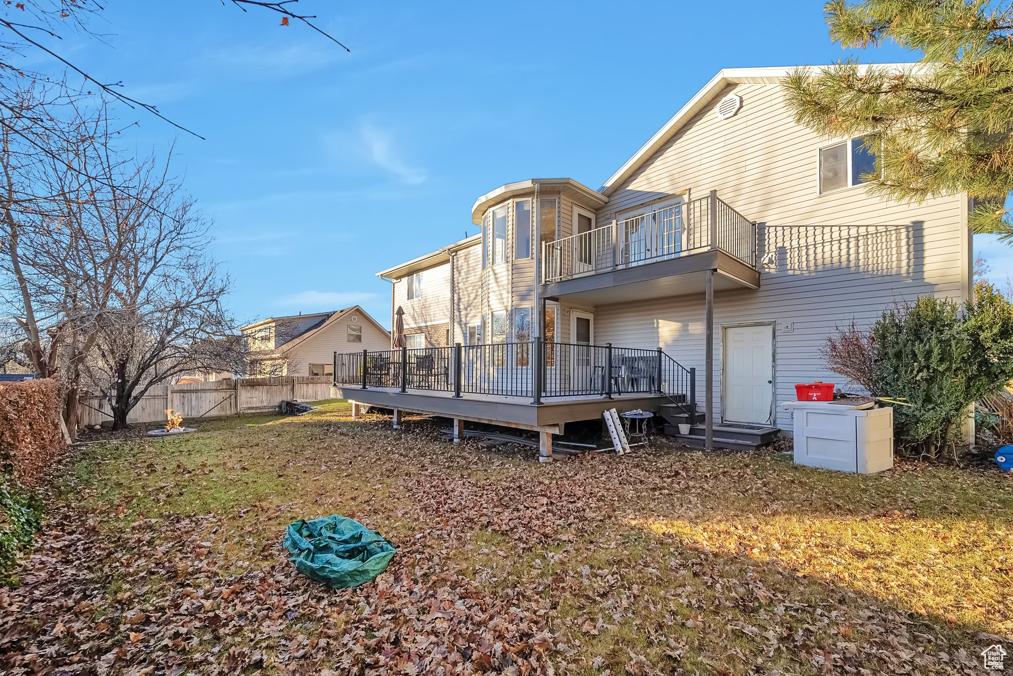 Rear view of property with a balcony