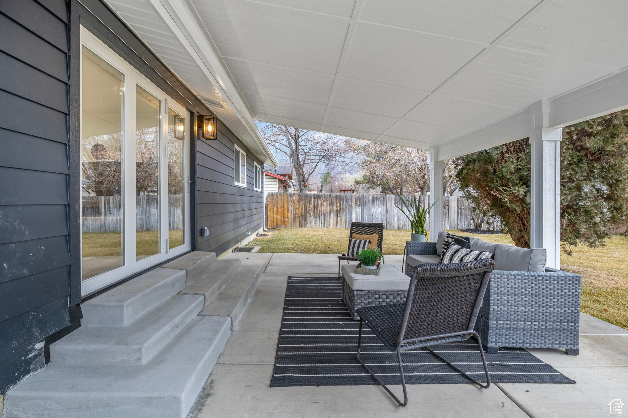 View of covered patio / terrace off the main floor family room.