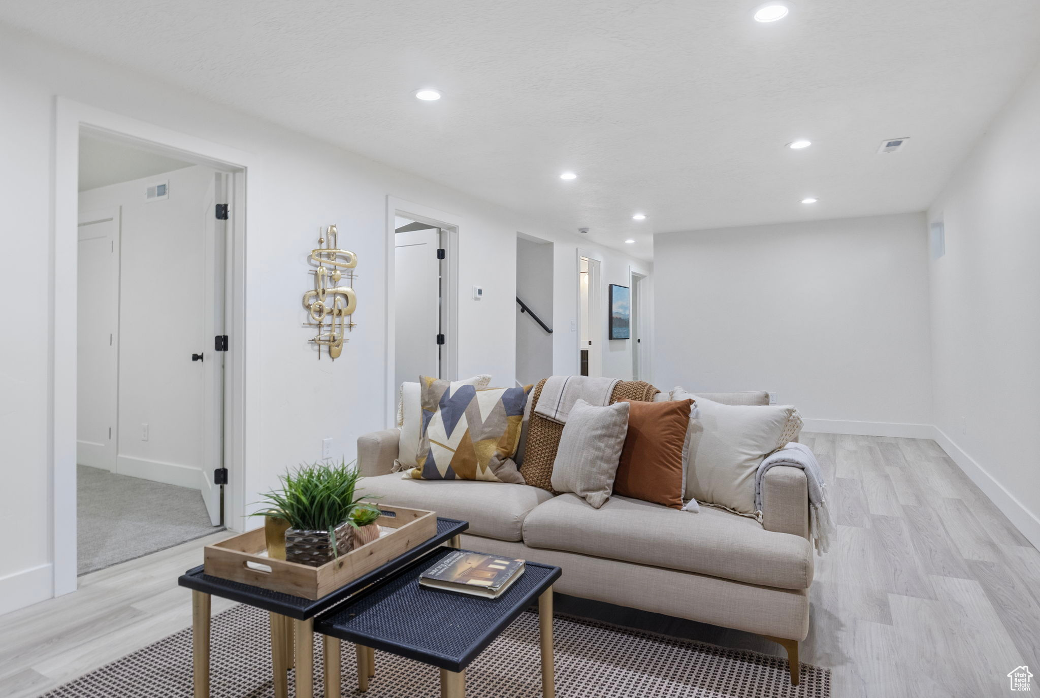 Living room featuring light LVP flooring