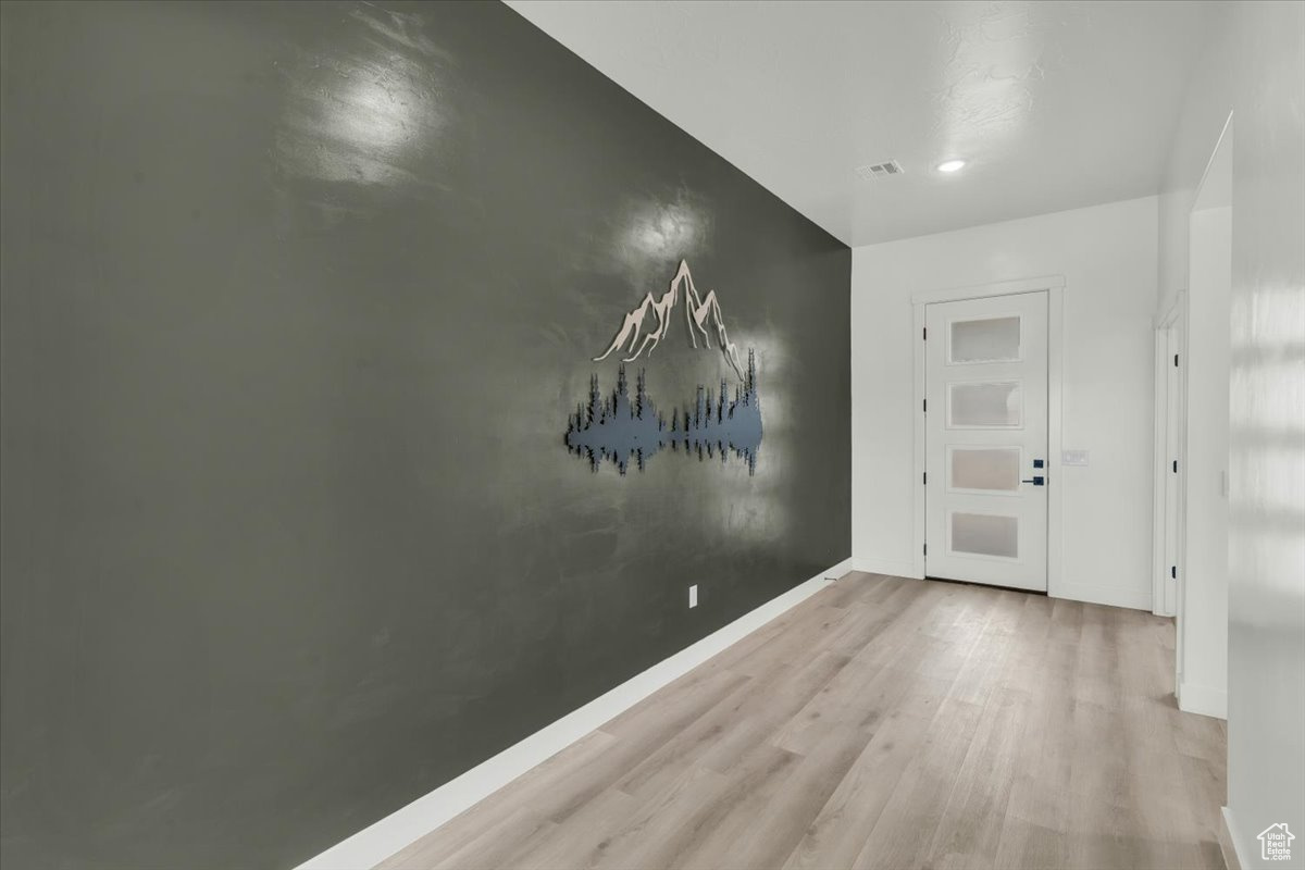 Hallway featuring light hardwood / wood-style floors