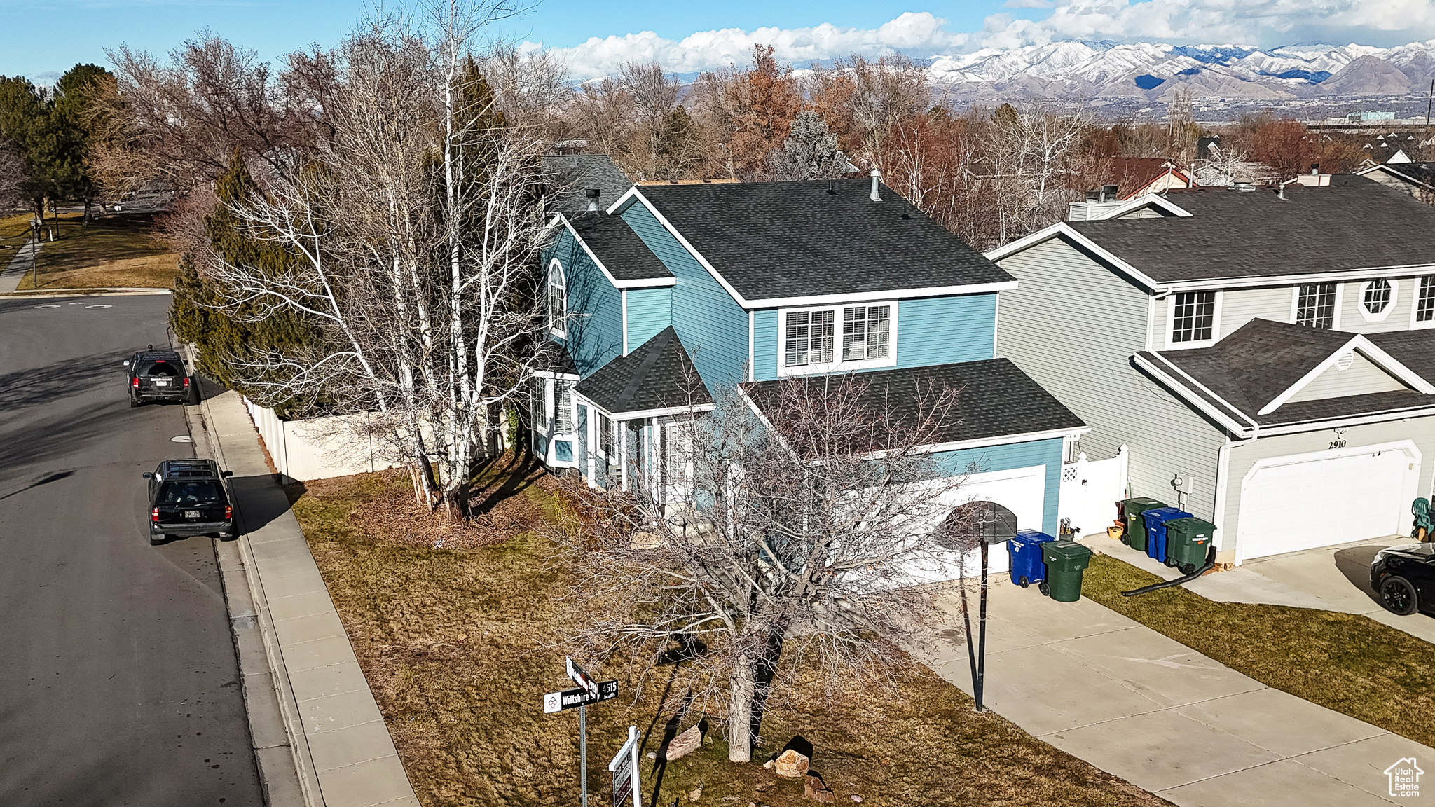 View of front facade featuring a mountain view and a garage