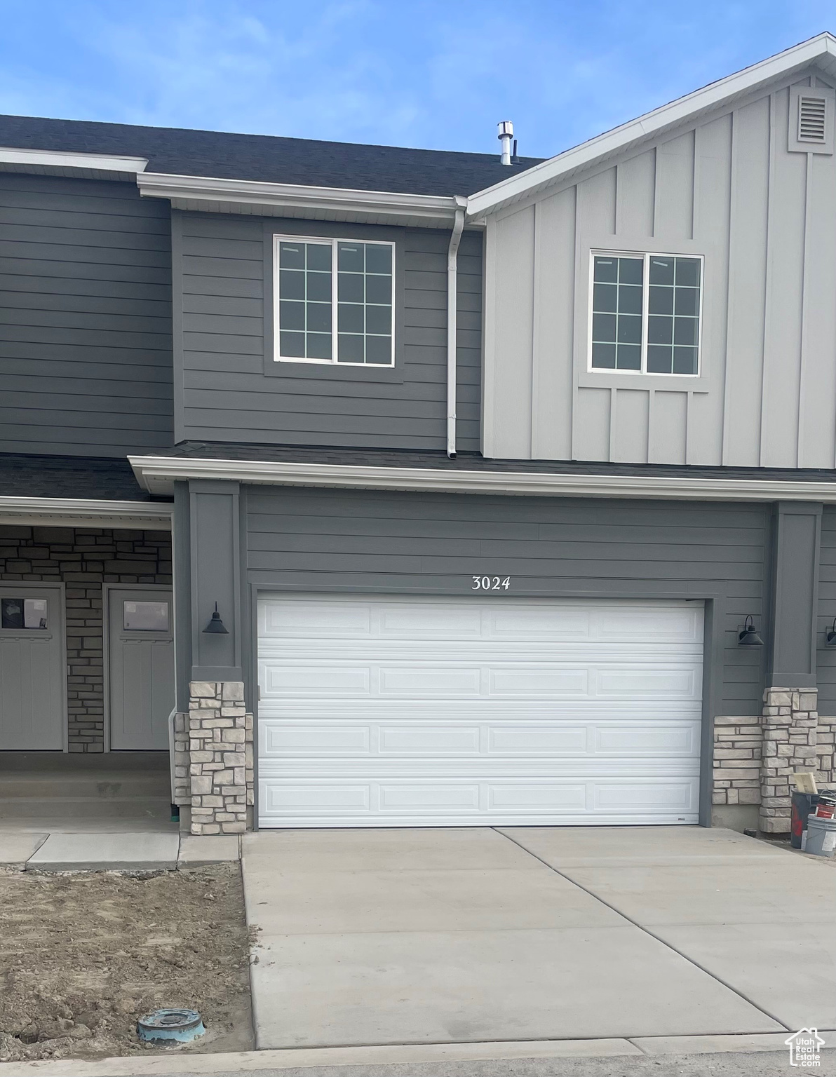 View of front of property featuring a garage