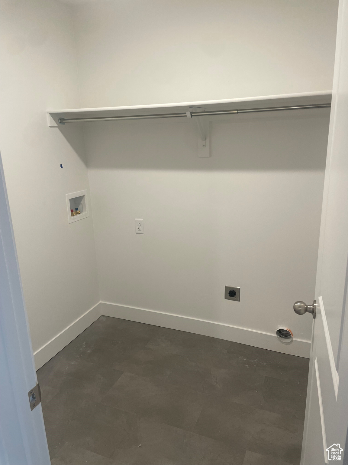 Laundry area featuring hookup for an electric dryer and hookup for a washing machine