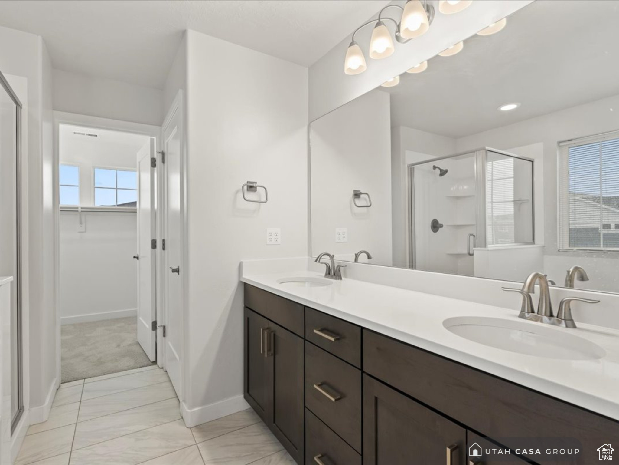 Bathroom with vanity and an enclosed shower