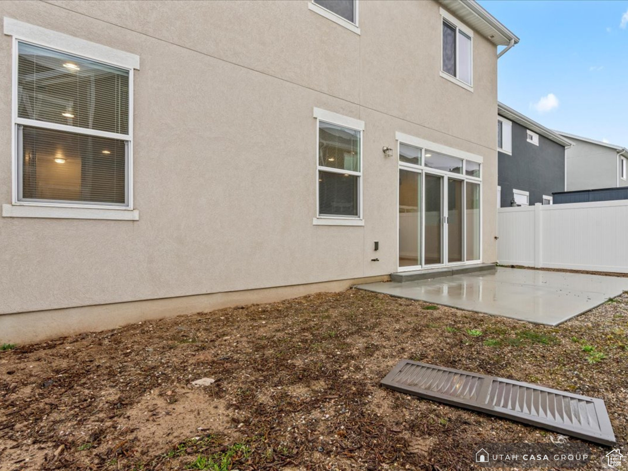 Back of property with a patio