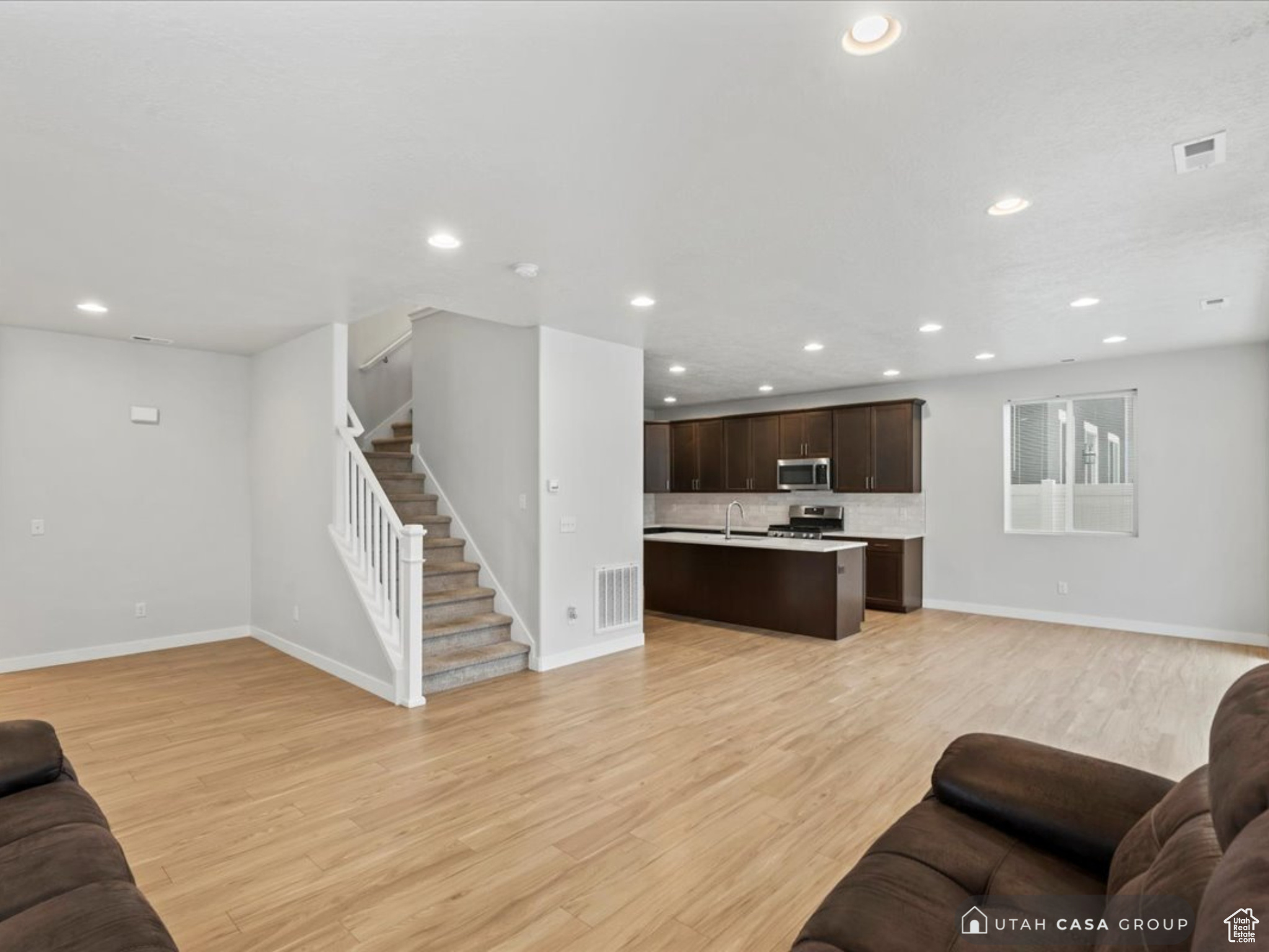 Living room with light wood-type flooring