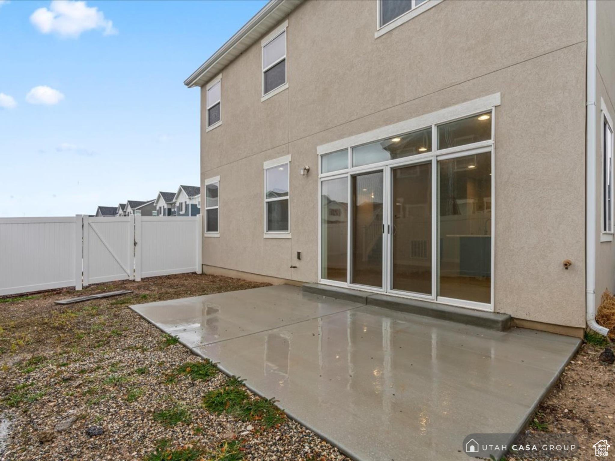 Rear view of property featuring a patio