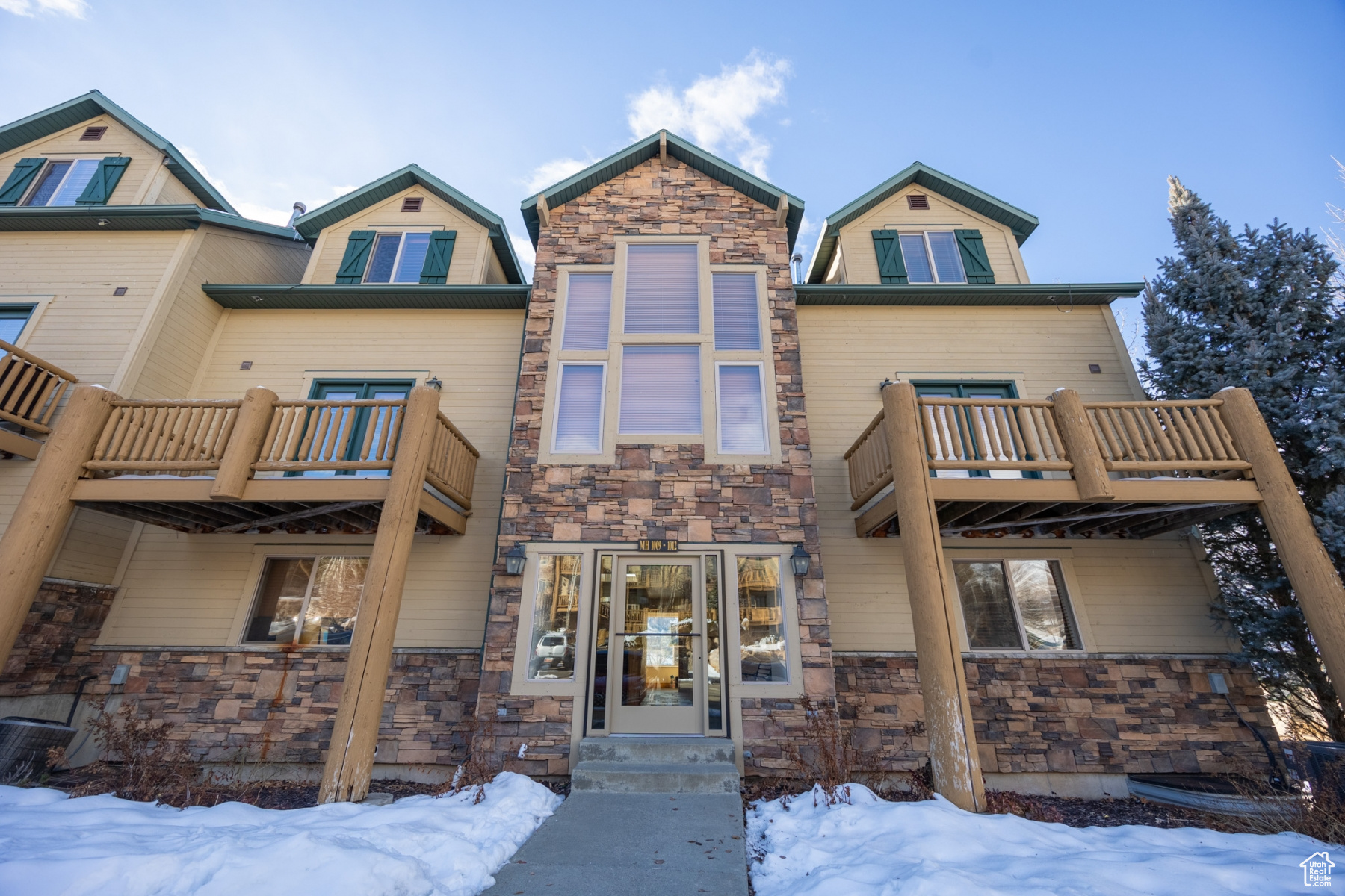 View of front of property featuring a balcony