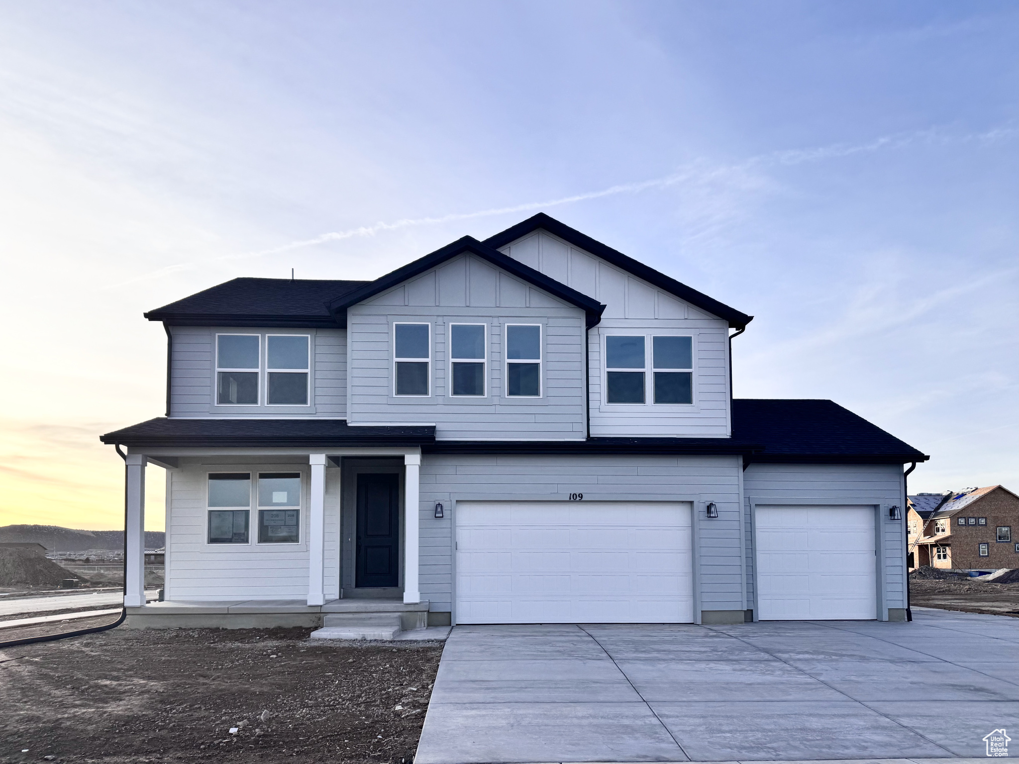 View of property featuring a garage