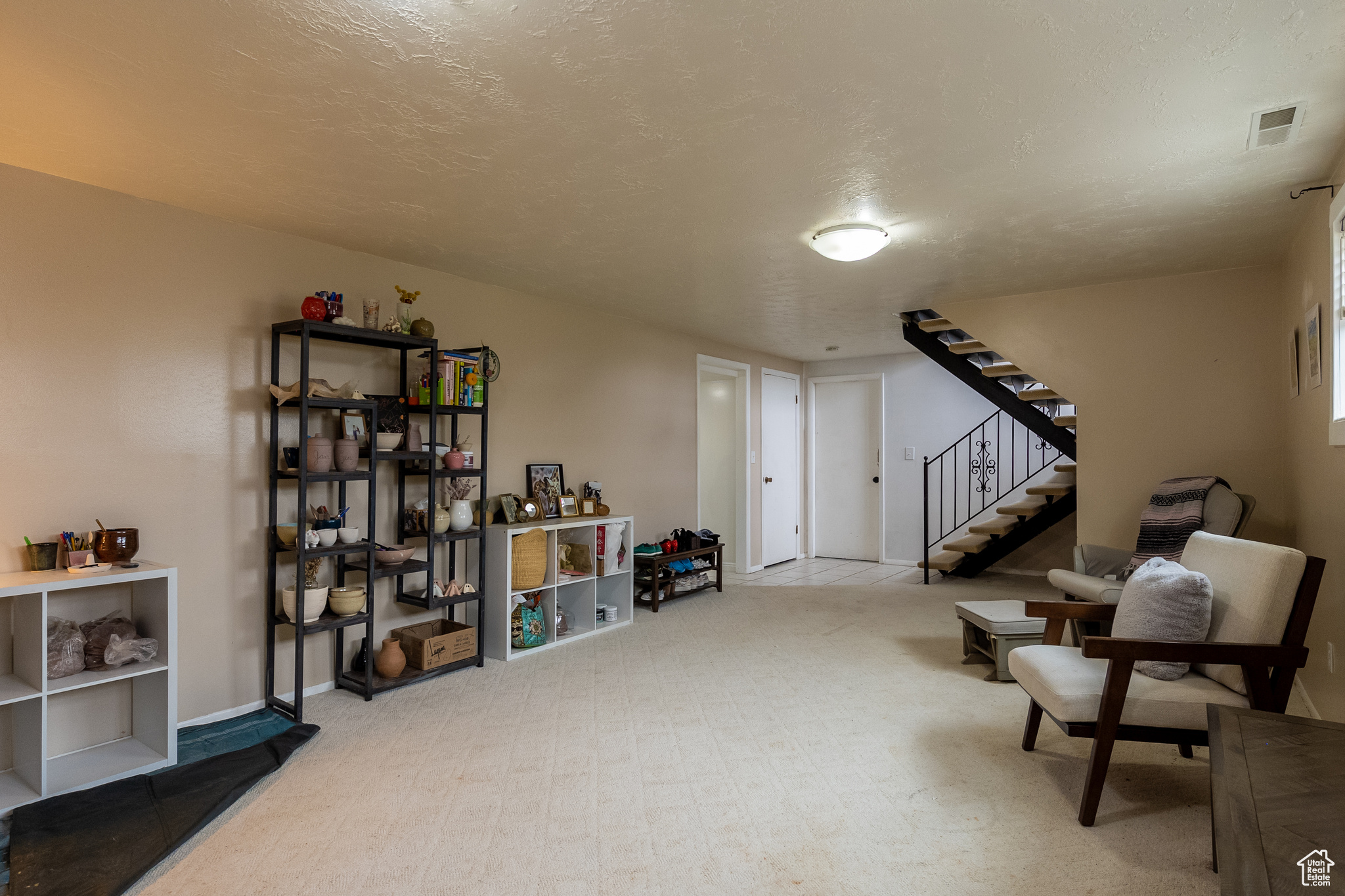 Basement with a textured ceiling