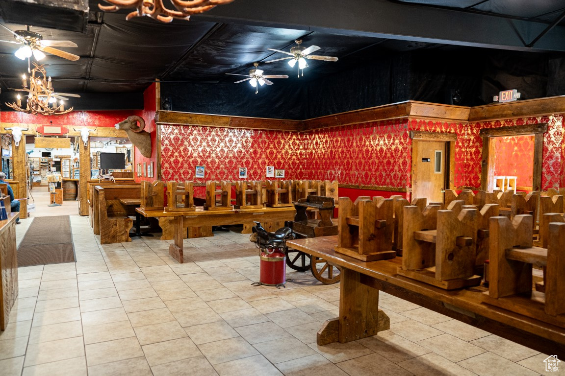 Interior space with tile patterned floors and billiards