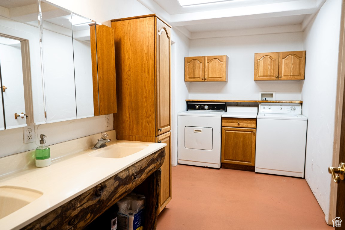 Kitchen with sink and washer / dryer