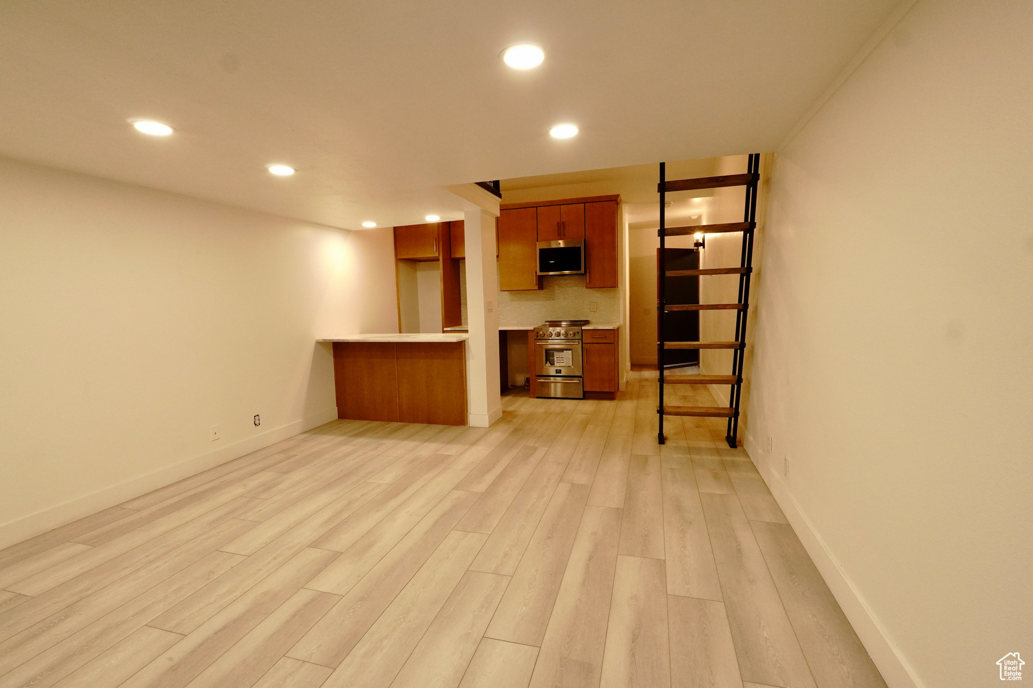 Unfurnished living room featuring light wood-type flooring