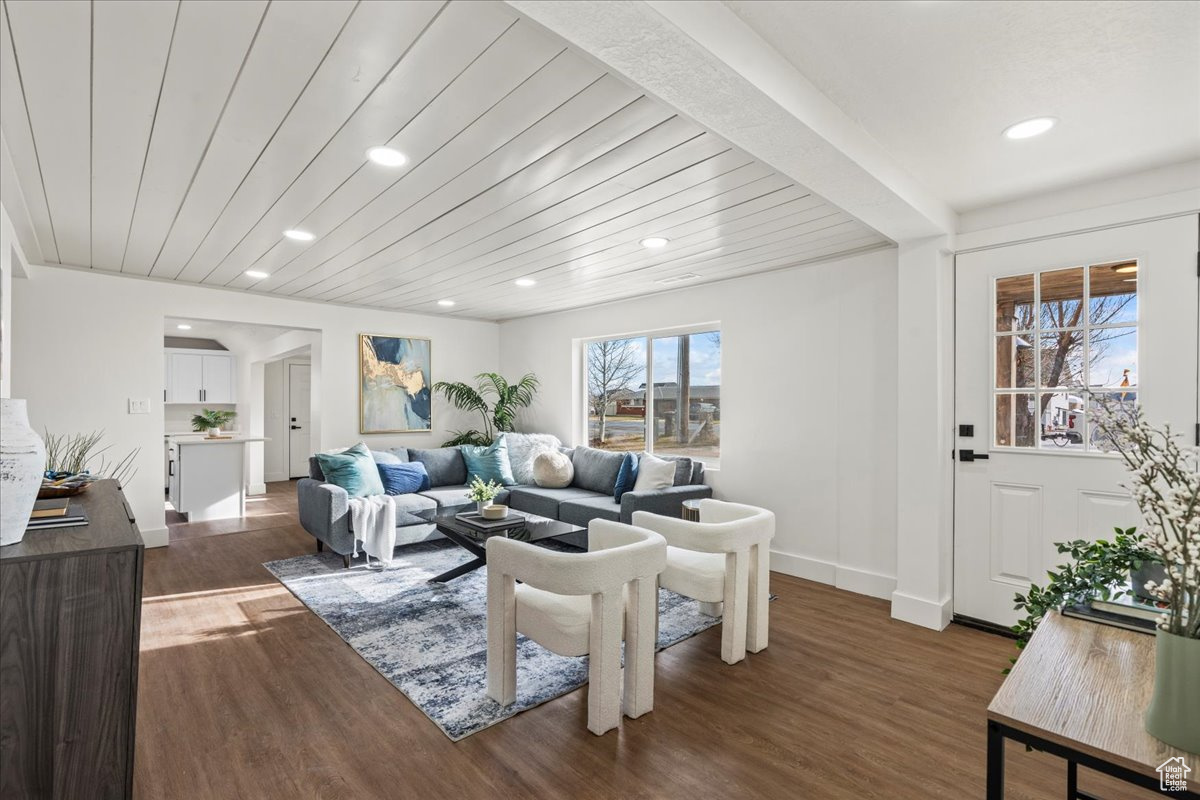 Living room featuring hardwood / wood-style floors and wooden ceiling