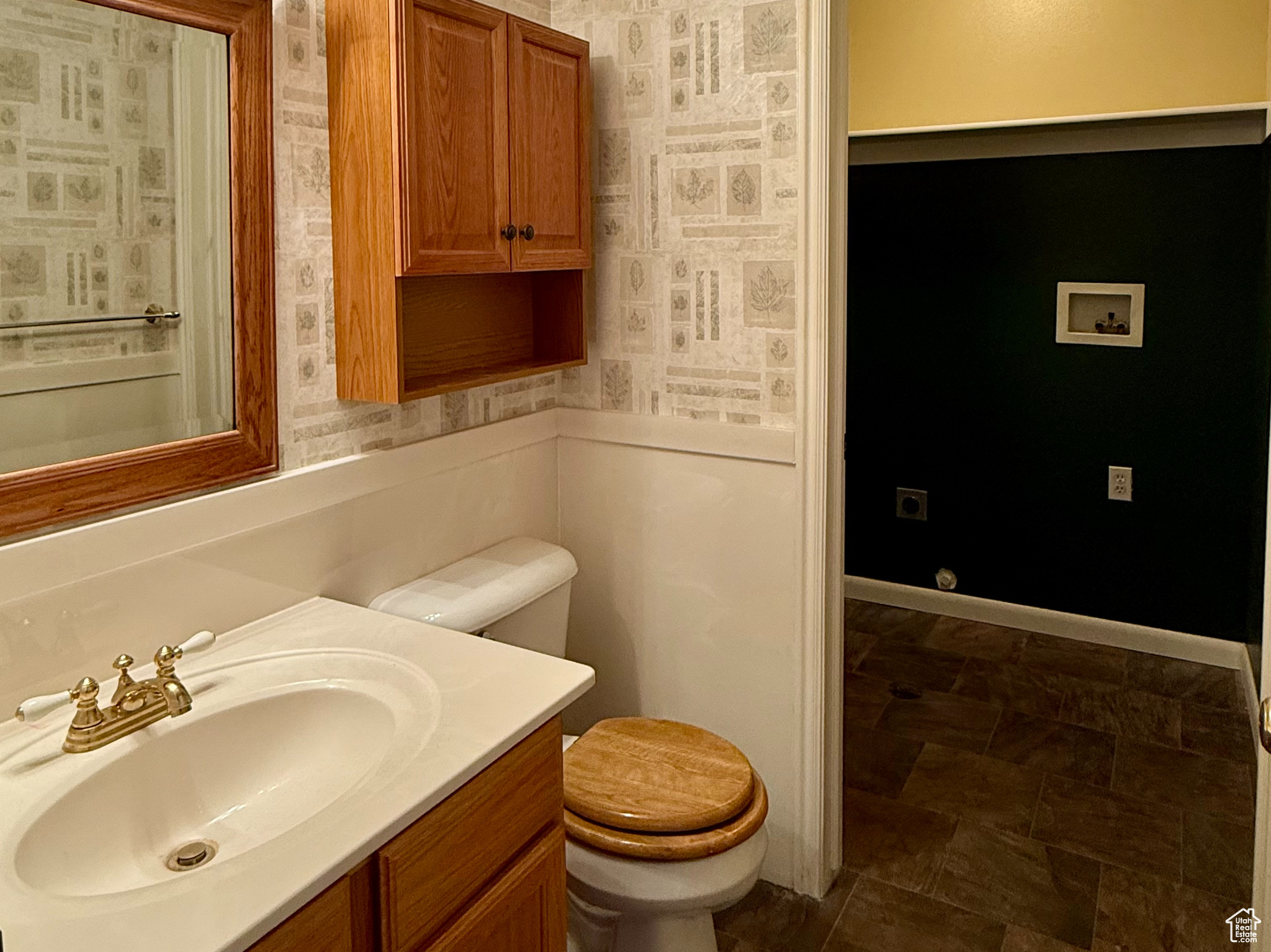 Bathroom with vanity, toilet, and a textured ceiling