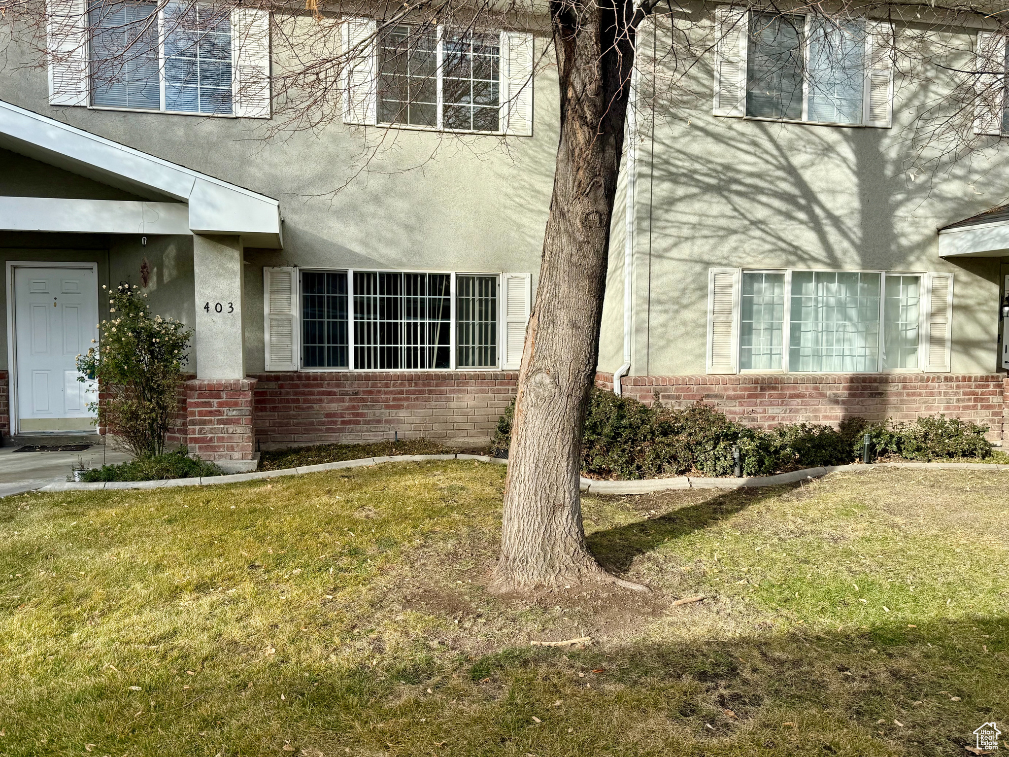 View of side of property with a yard