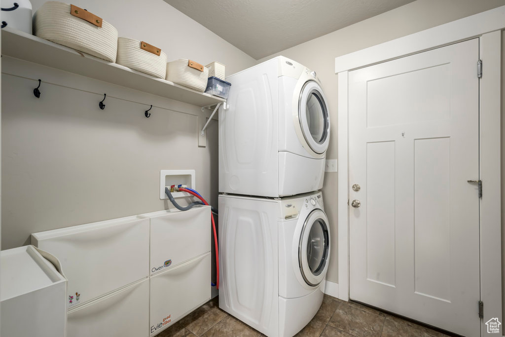 Clothes washing area with stacked washer and dryer