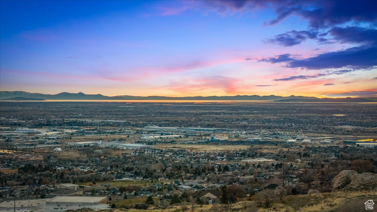 Aerial view at dusk featuring a mountain view