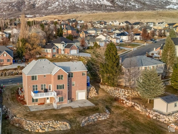 Snowy aerial view featuring a mountain view