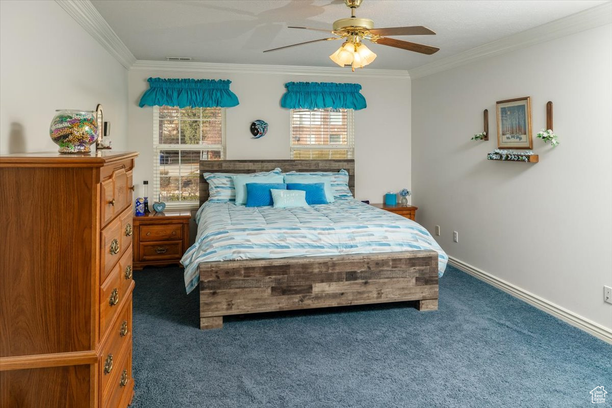 Master suite  with ceiling fan, and crown molding