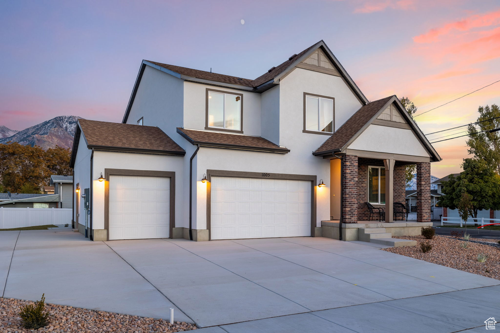 View of front of house featuring a mountain view and a garage