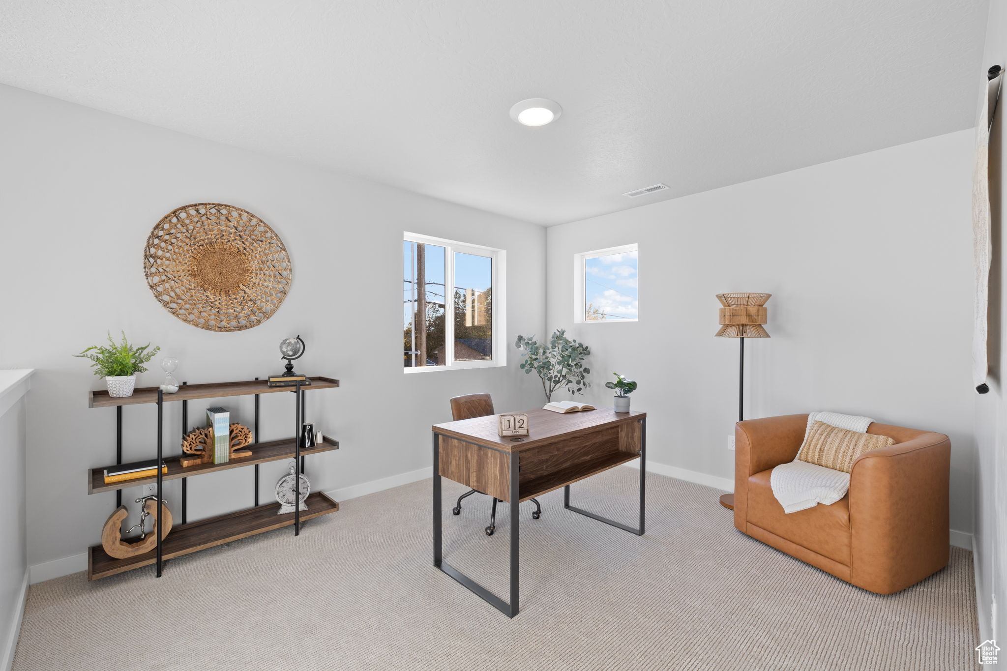 Office area with light colored carpet