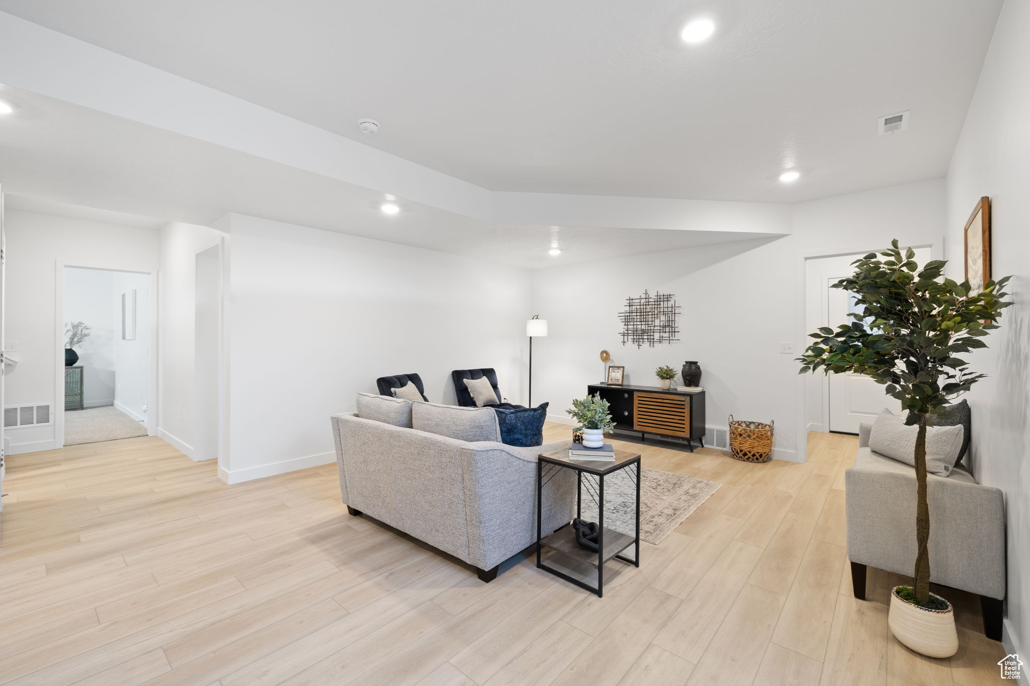 Living room with light hardwood / wood-style flooring