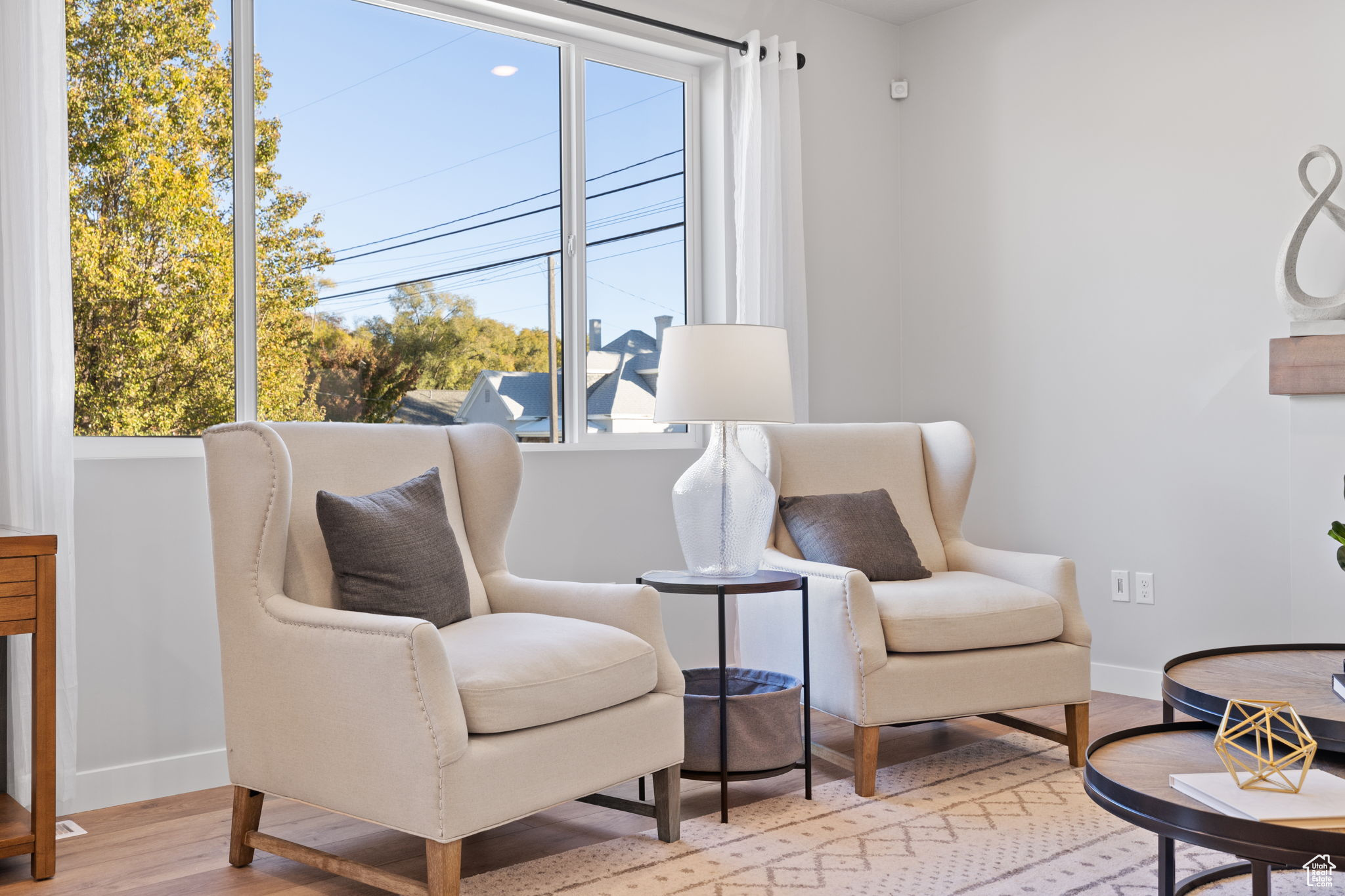 Sitting room featuring light hardwood / wood-style floors and a wealth of natural light