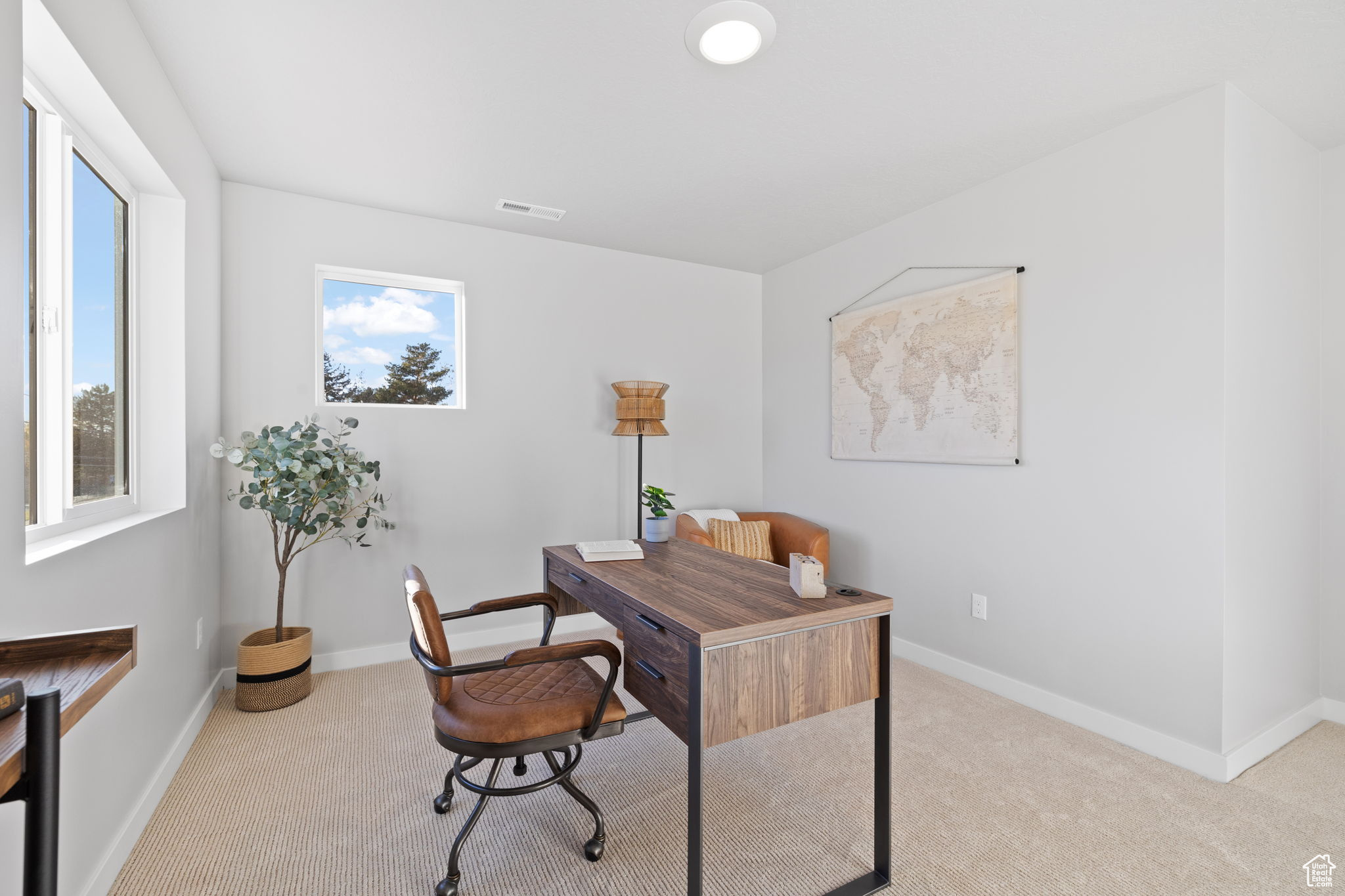 Office with light colored carpet