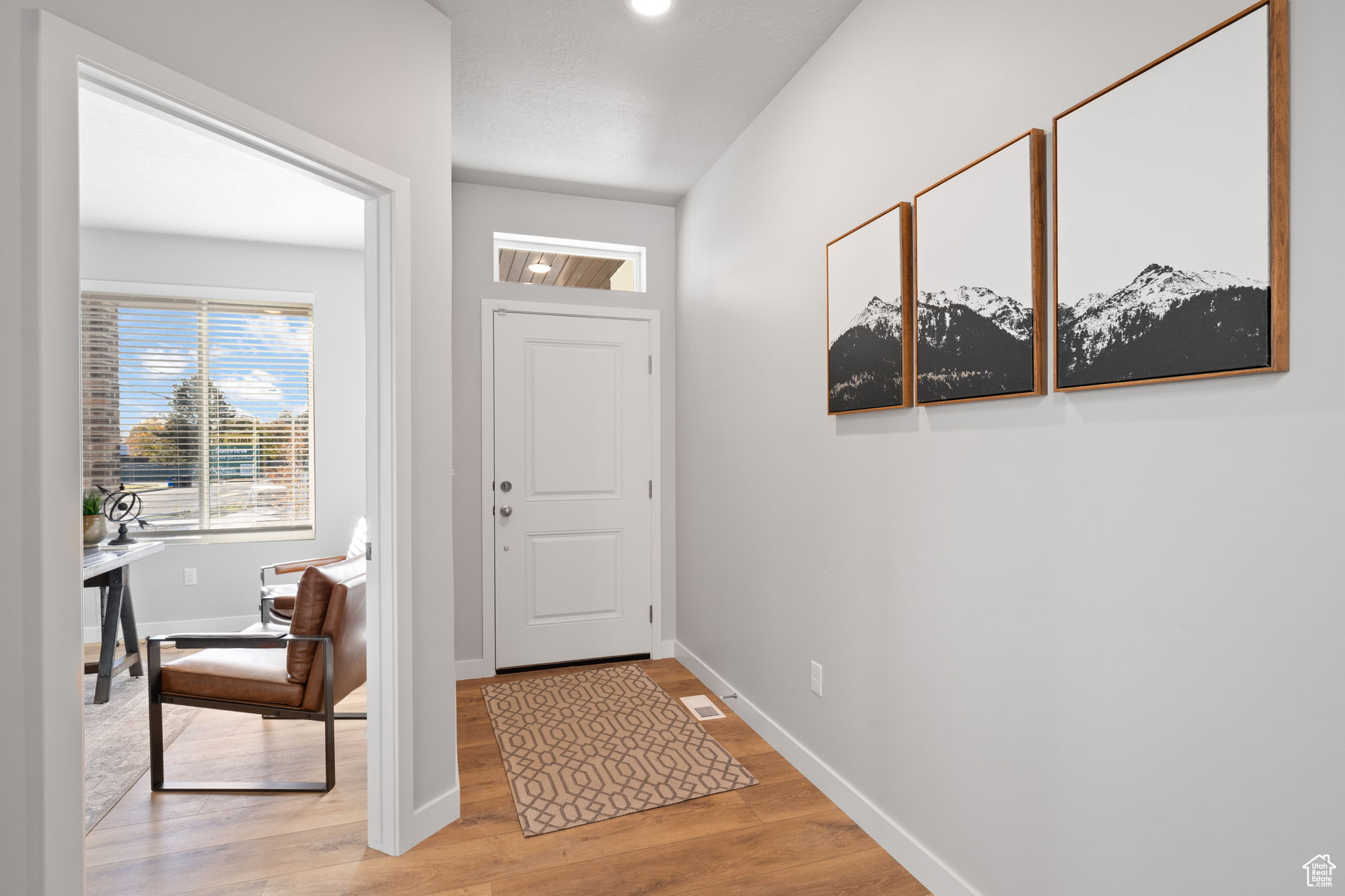 Entryway with light hardwood / wood-style floors