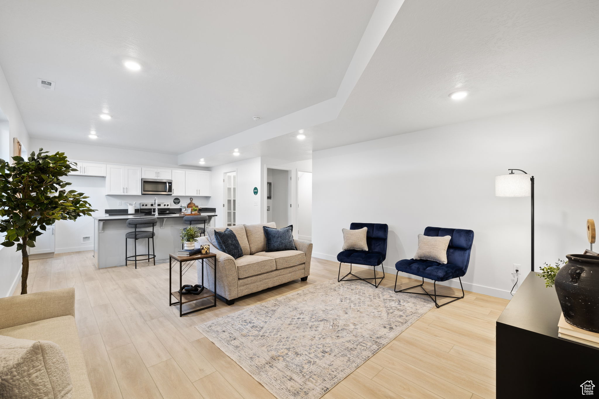 Living room with light hardwood / wood-style flooring