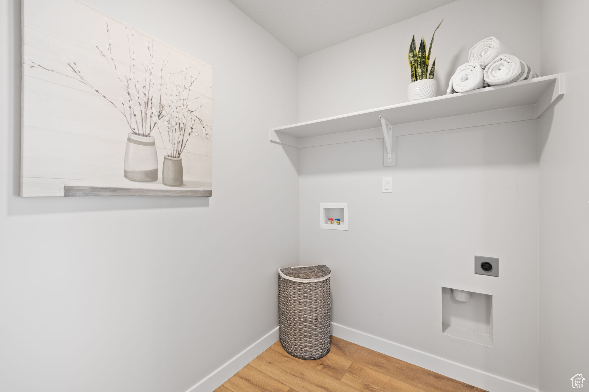 Washroom featuring electric dryer hookup, washer hookup, and wood-type flooring