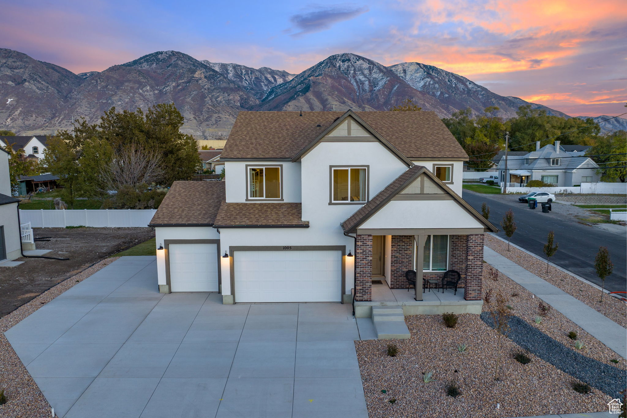 View of front facade with a mountain view and a garage