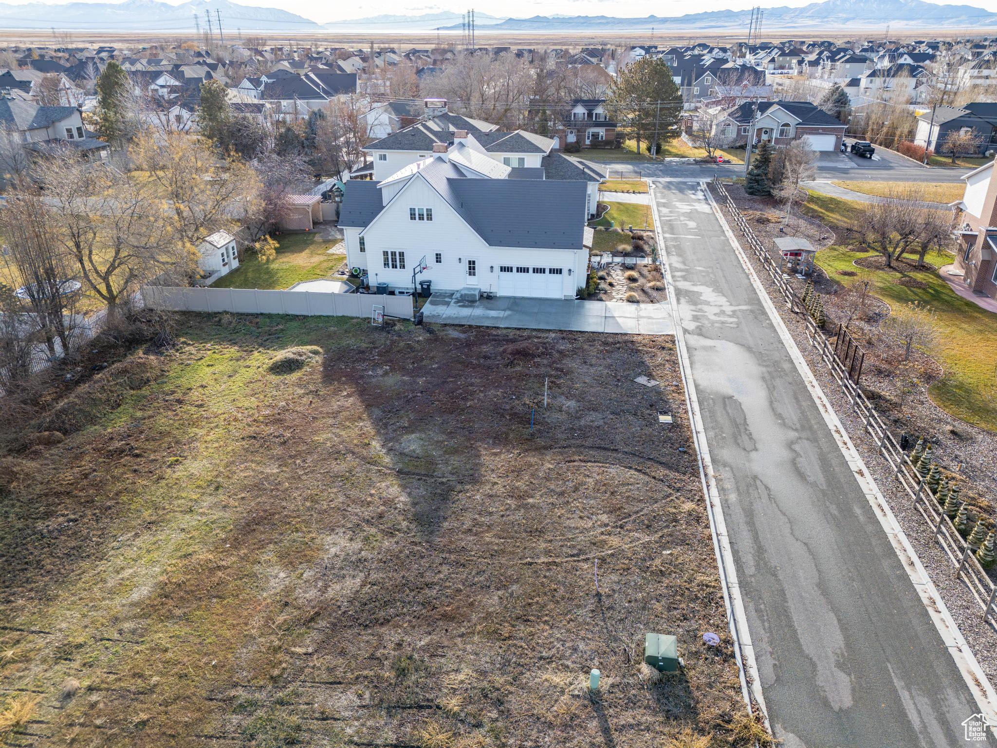 Birds eye view of property with a mountain view