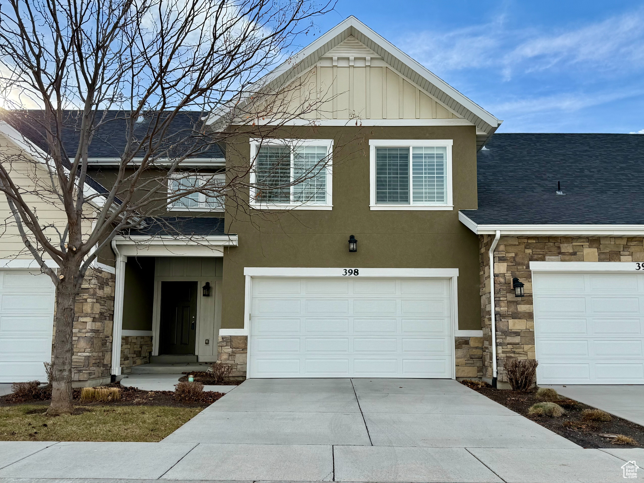 View of front facade featuring a garage