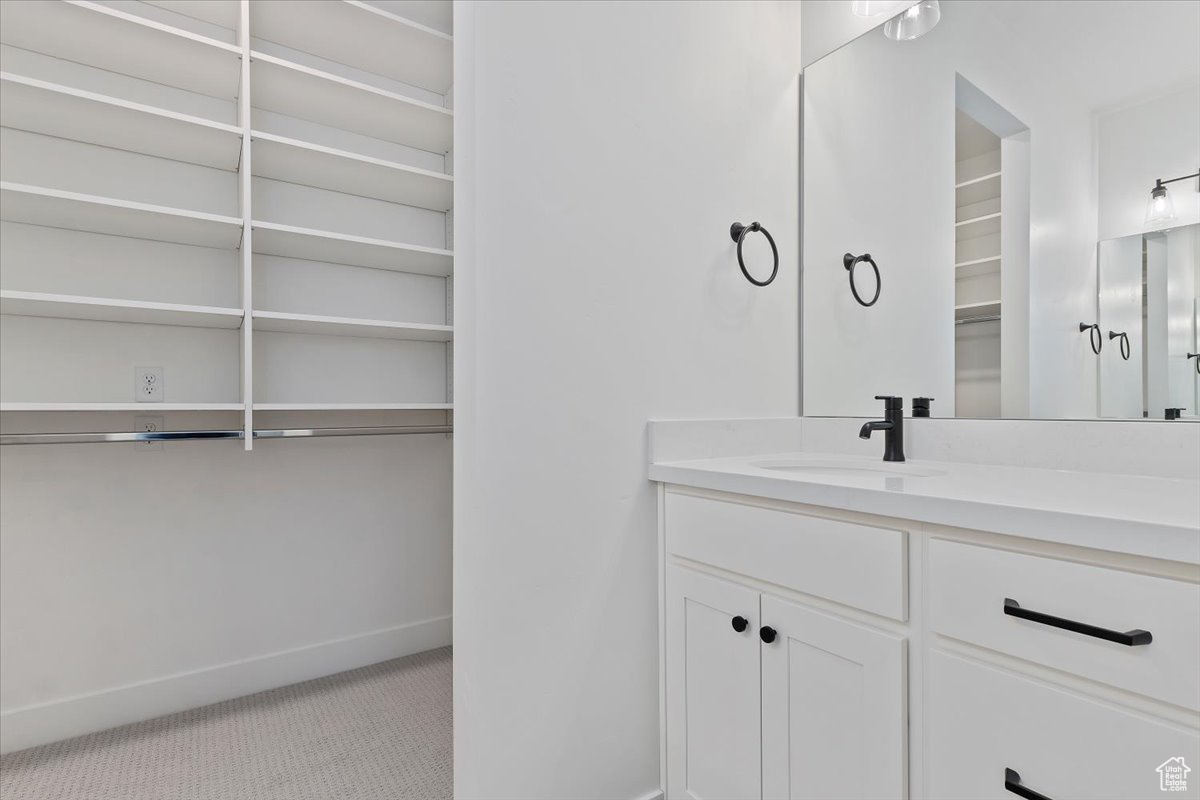 Bathroom featuring double his and hers vanity